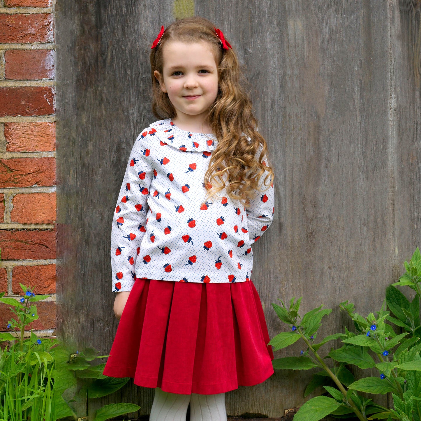 Strawberry frill blouse on toddler girl