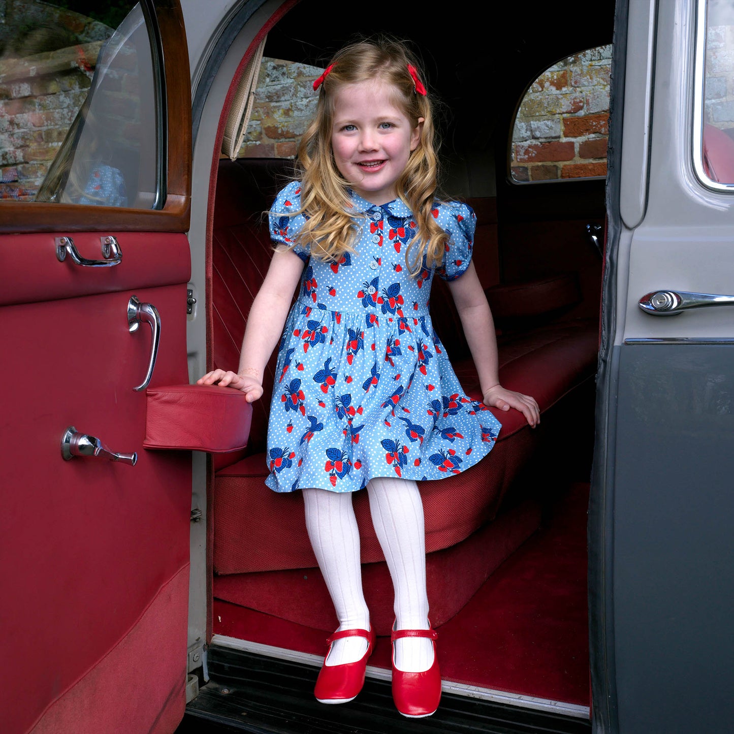 Strawberry print dress on toddler girl