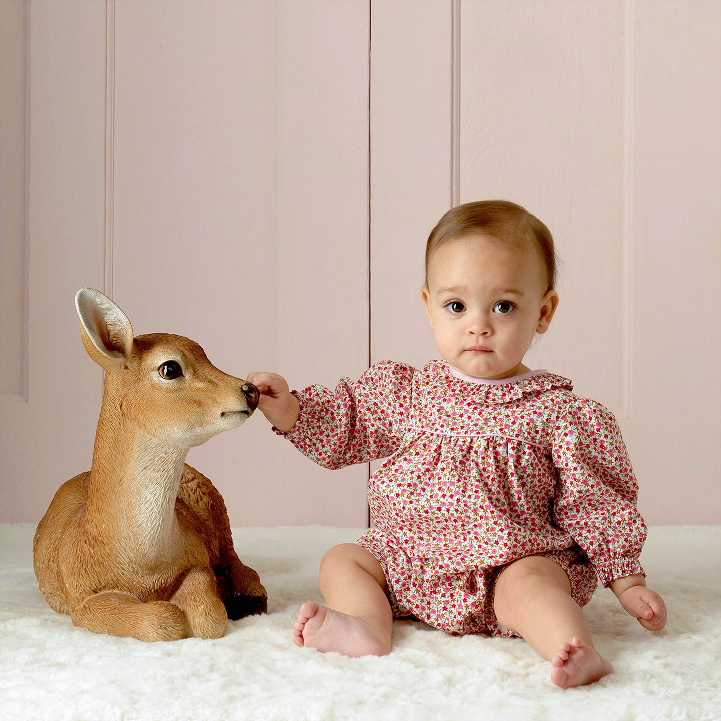 Floral onesie on baby girl