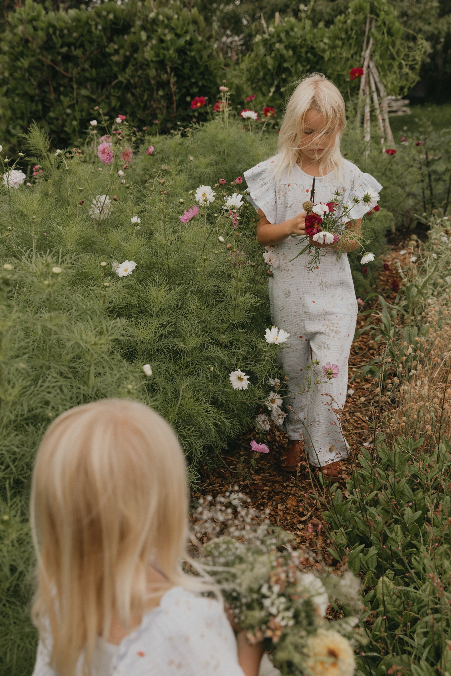 Floral jumpsuit in garden