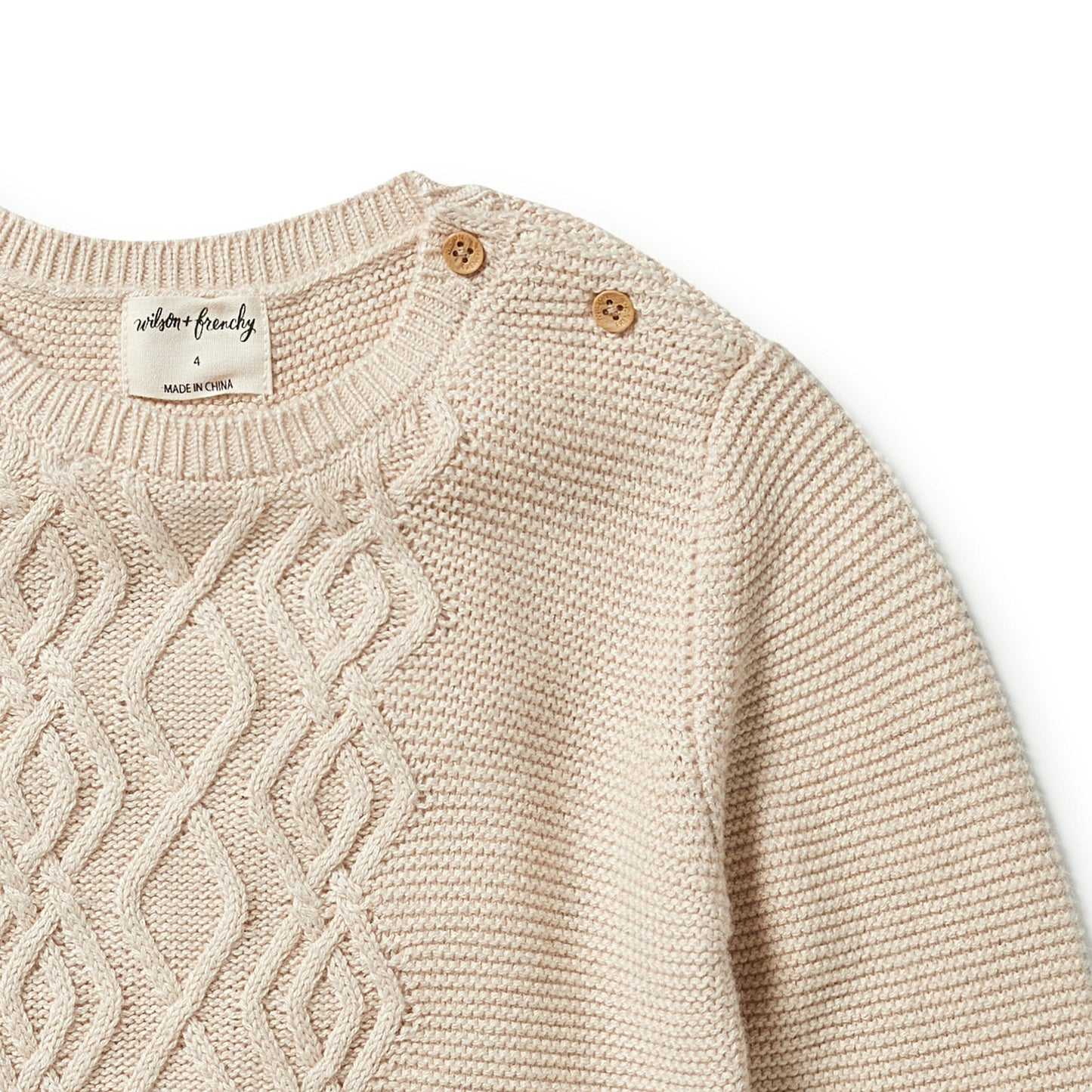 Cream knit sweater up close