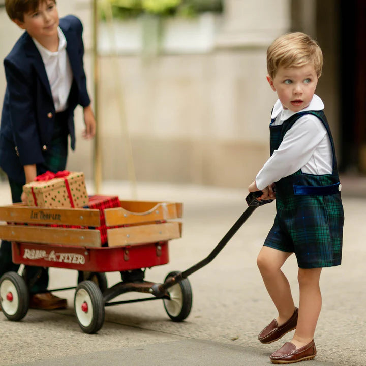 Green and blue plaid romper on toddler boy