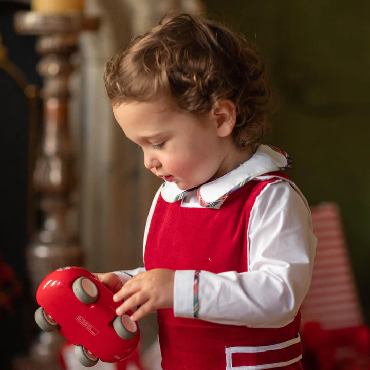 Red romper on toddler