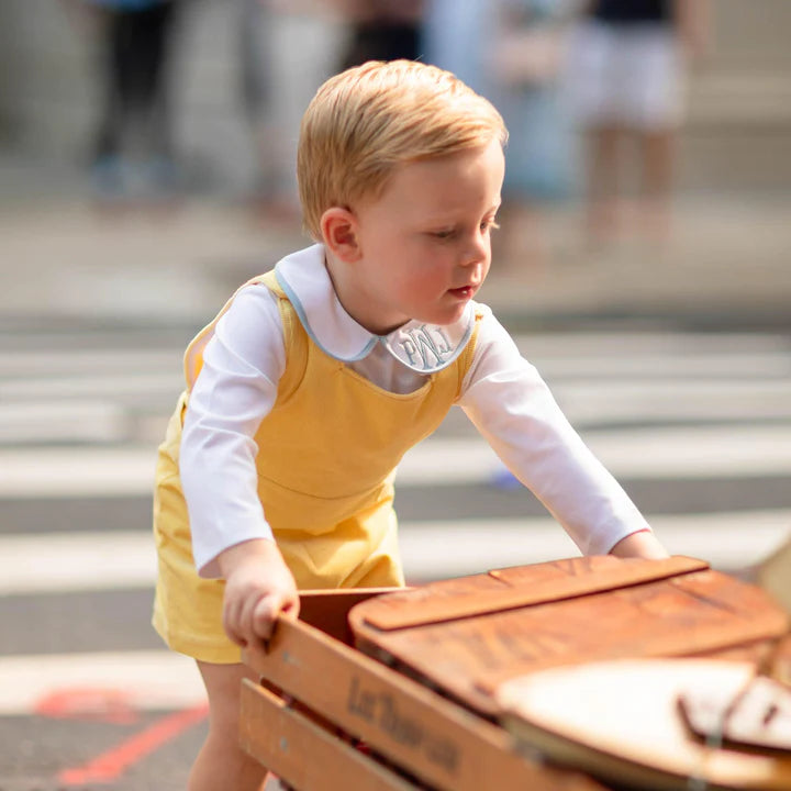 Yellow romper on toddler boy